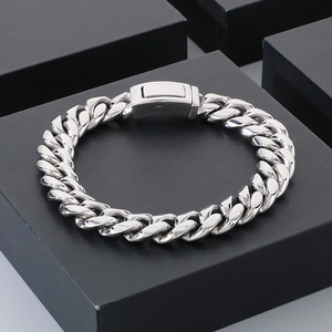Detailed view of silver 12mm Miami Cuban chain link bracelet with a secure rectangle clasp