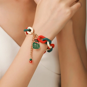 Close-up of Christmas resin chain bracelet with Merry Christmas gift box charm