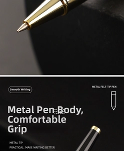 Macro shot of professional metal rollerball pen tip with matte black and gold finish