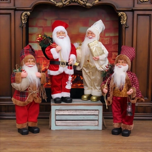 Detailed view of four Santa Claus figurines with velvet clothes and fur on a fireplace