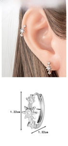 Detail view of silver star hoop earrings with size measurements and model try-on effect