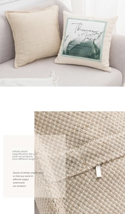 Close-up of textured knit fabric and abstract embroidery on minimalist Nordic cushion