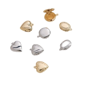 Selection of 14k gold-plated and silver locket pendants in heart, oval and round shapes