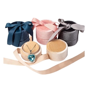 Round velvet jewelry gift boxes with silk ribbon bows in multiple colors for necklaces