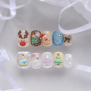 Detail of 3D Christmas nail stickers featuring reindeer, trees and Merry Christmas text