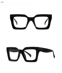 Detail view of bold black square frame sunglasses with transparent lenses from two angles