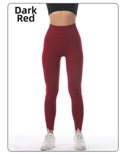 Close-up of high waist red yoga leggings showing seamless stretch fabric and lifting cut