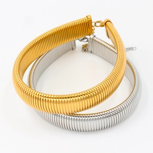 Detail of gold and silver tubogas choker necklaces with lobster clasp and extension chain