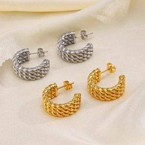 French vintage C-shaped twisted earrings in 18K gold and silver finish on silk