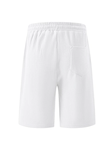 Detail view of the back pocket and ribbed corduroy texture on white casual shorts