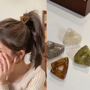 Minimalist triangular hair claw clip set for high ponytail in amber, green and grey colors