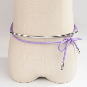 Purple woven rope belt with silver metallic bar and knot detail on woman waist