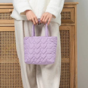 Chic purple quilted tote bag with heart patterns and soft padded nylon texture