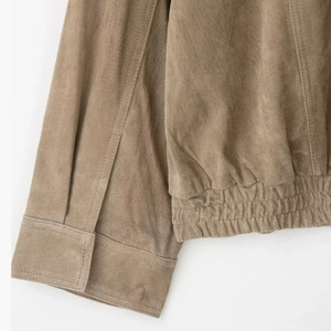Brown faux suede jacket featuring elastic cuffs and hem with premium stitching texture