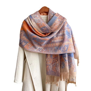 Ethnic paisley jacquard shawl scarf in blue and orange with tassel fringe detail