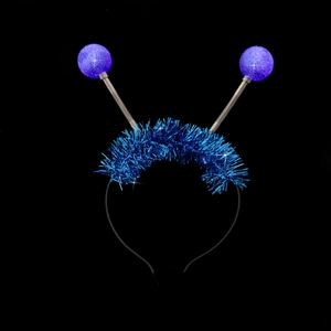 Detail view of blue tinsel alien headband with spring balls and glowing effect
