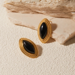Macro detail of 18k gold stainless steel marquise earrings with black onyx on stone