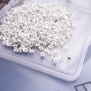 Detailed macro shot of irregular S925 sterling silver beads for DIY jewelry making
