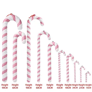 Pink and white candy cane props in various sizes with glitter finish for Christmas decor