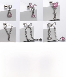 Detail view of silver titanium steel earrings set with pink zircon hearts and bows