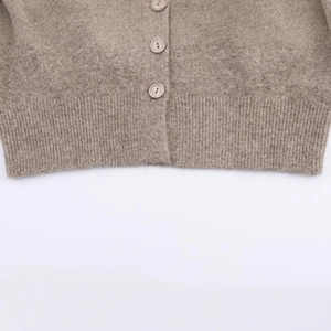 Women's knit cardigan featuring soft earth-toned plush fabric and ribbed hem details