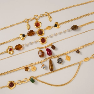 Luxurious gold resin sweater necklaces with assorted vintage pendants and coin details