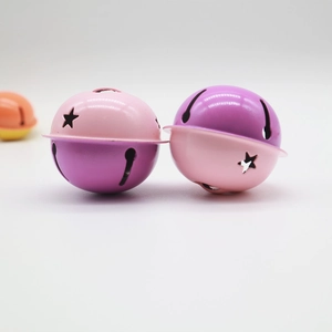 Close-up of 4cm pink and purple star-patterned metal bells for keychain accessories