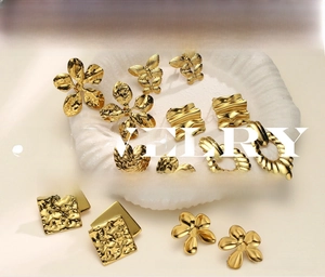 Detailed shot of 18K gold stainless steel earrings with unique crumpled metal texture