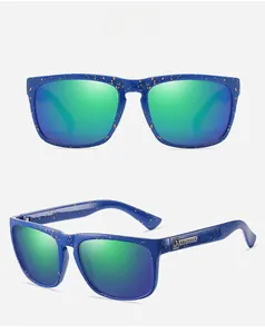 Detail view of square sports sunglasses with blue speckled frames and gradient lenses