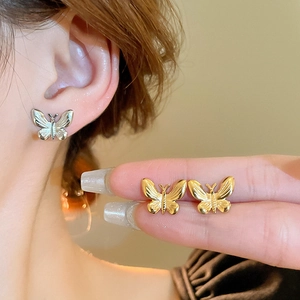 Minimalist stainless steel butterfly stud earrings in gold and silver finish for women