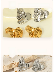 Close-up of 18K gold plated heart earrings showing thick plating and mirror polish
