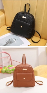 Detail of embossed floral heart pattern on PU leather mini backpack with gold hardware