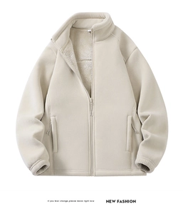 Detail of soft cream fleece jacket showing the high collar and warm teddy fleece lining