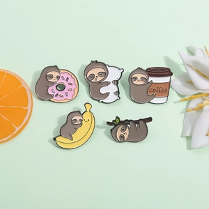 Set of five cute cartoon sloth enamel pins with donuts, bananas and coffee motifs