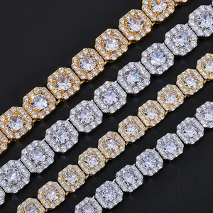 Macro detail of gold and silver square iced out chain necklaces with sparkling zircons