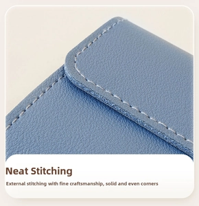 Detailed macro view of high-quality litchi grain leather and neat precision stitching