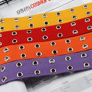 Street style canvas belts with double rows of metal eyelets in yellow, red, orange and purple