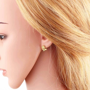 Elegant gold-plated rose flower stud earrings worn by a model in a side profile view