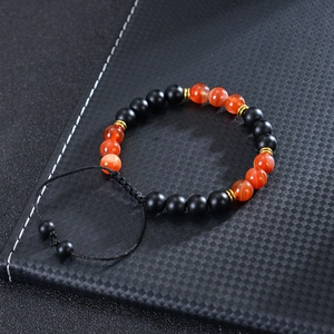 8mm Sunstone and matte black bead braided bracelet with golden metal spacers