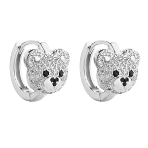 Detailed view of silver hoop earrings featuring sparkling pave teddy bear charms