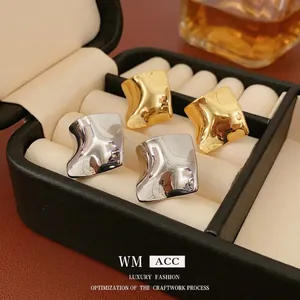 Minimalist twisted square metal stud earrings in gold and silver finish with mirror polish