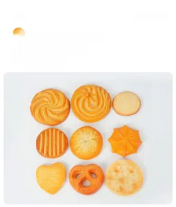 Flat lay of 9 realistic PVC simulation cookie keychains with various shapes on white background