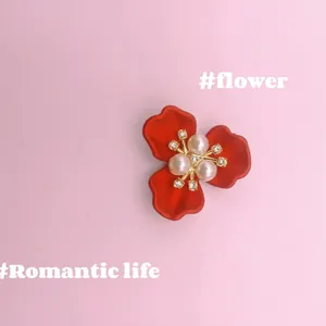 Red flower brooch with three pearls and crystals on a gold base, elegant bridal accessory