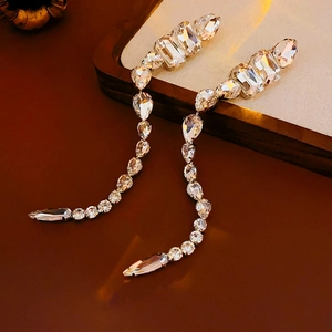 Detail of silver drop fringe earrings with sparkling teardrop and marquise crystals