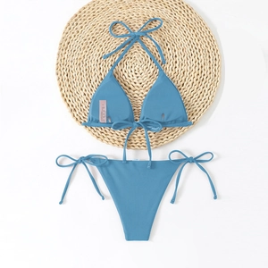 Close-up of ribbed fog blue bikini set with wash label and adjustable side ties