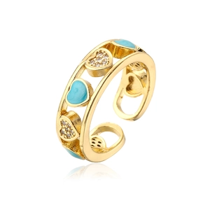 Detail of 18K gold plated heart ring with blue enamel and zircon inlay