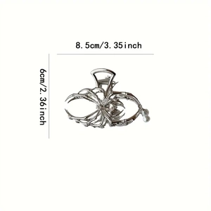 Silver spider hair claw clip with pearls and rhinestones measuring 8.5cm by 6cm