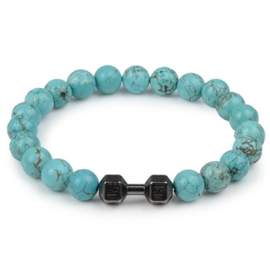 Macro shot of turquoise beaded bracelet with dark metal dumbbell charm on white background