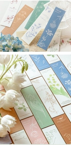 Detail showing letterpress floral bookmarks with embossed textures on premium specialty paper