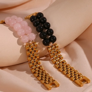 Detail of pink and black natural stones with gold stainless steel watchband link bracelets